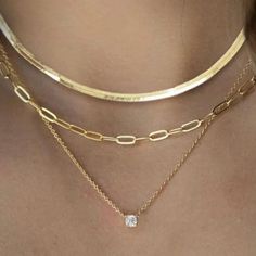 Experience luxury with our Layered Gold Necklaces set for women. This 3-piece 14K Vermeil Gold/Silver set includes a 16-inch clavicle herringbone necklace, a 17-inch paperclip style necklace, and an 18-inch necklace with a 1 carat total weight of flawless princess cut cubic zirconia pendant. These versatile pieces can be worn together as a layered style or separately to complement any outfit. Perfect for any occasion, this set makes a stunning gift for someone special. Don't miss out on the chan Elegant Jewelry Sets With Adjustable Chain, Elegant Gold Jewelry Set With Adjustable Chain, Gold Cubic Zirconia Jewelry Sets With Clavicle Chain, Elegant Gold Herringbone Choker Necklace, Elegant Silver Herringbone Necklace With Adjustable Chain, Elegant Gold Herringbone Necklace, Elegant Sterling Silver Plated Jewelry, Elegant Plated Sterling Silver Jewelry, Elegant 14k Gold Jewelry