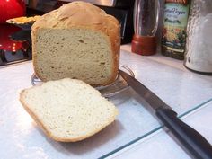 a loaf of bread sitting on top of a counter next to a knife