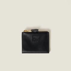 Miu Miu Small Leather Wallet - Black | Editorialist Black Wallets With Engraved Logo For Everyday Use, Miu Miu Formal Bag With Removable Pouch, Chic Black Compact Wallet, Miu Miu Love Wallet, Prada Small Wallet, Luxury Black Compact Wallets, Small Leather Wallet, Miu Miu, Leather Wallet