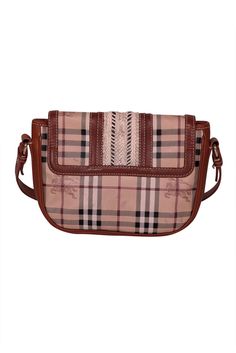 Introducing the perfect everyday bag Burberry's tan leather and signature plaid crossbody bag. The chic combination of tan leather and the iconic Burberry plaid makes this bag a classic beauty. Carry your essentials in style and turn heads with this playful and stylish crossbody. Made in Italy Leather and coated canvas Crochet trim Magnetic button front closure Buckle front detail One interior zipper pocket Wear on front trim Height 7” Width 11” Depth 2.5” Strap drop 23” Canvas Crochet, Burberry Purse, Burberry Plaid, Tartan Pattern, Crochet Trim, Classic Beauty, Everyday Bag, Burberry Bag, The Chic