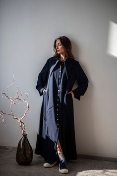 "This dark blue wool shirt dress is a highly versatile staple that should find its place in every lady's wardrobe. It features a classic button up silhouette with a flared calf-length fluid skirt that dances elegantly around the legs with every move. We cannot miss the eye-catching oversized pointed collar that balances the long hem. The carefully crafted French cuff is another well-though detail adding elegance and sophistication to the entire look. Wear these cuffs either folded, or in their full length. Moreover, have you noticed that this long dress comes with pockets? This elegant wardrobe staple is crafted from a wool and viscose crinkle-textured fabric called crepe. The unique three-dimensional texture of the fabric elevates this timeless silhouette to the next level, making the dre Long Collar Shirt, Ethereal Clothing, Whimsical Outfit, Elegant Shirt Dress, Casual Sundresses, Collar Shirt Dress, Fairy Tale Princess, Flare Shirt, Sun Dress Casual