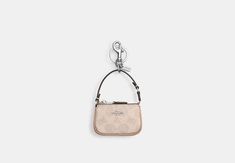 Mini Nolita Bag Charm In Signature Canvas | COACH OUTLET Coach Mini Bag, Sling Bag Mini, Micro Bags, Sustainable Bag, Mini Handbag, Coach Outlet, Handbag Charms, Signature Canvas, Mini Handbags