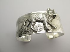 "Fox cuff bracelet Magnificent hand crafted fox cuff bracelet From MyElegantThings \"Angelina Verbuni Design Studio\" Antique silver plated over brass cuff. Cuff is an engraved with gorgeous vines. 1 inch width. Will fit 6 to 8 inches. Gorgeous and what a statement." Unique Cuff Bracelets For Gifts, Unique Cuff Bracelet For Gift, Fox Bracelet, Art Deco Inspired Jewelry, Bridal Hair Ornaments, Large Cuff Bracelet, Fox Jewelry, Vintage Hair Clips, Vintage Fox