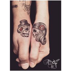 two people with matching tattoos on their hands