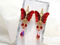 This is a fancy red wings butterfly drop earrings that goes well with Korean hanbok. This hanbok accessory is great for special parties or various events. ⭐The earrings in the picture are D type(stainless push bag). ⭐ Decorate more stylishly with Hanbok. Go look Adult Modern Hanbok Dress : https://www.etsy.com/shop/LunarJogak?ref=seller-platform-mcnav&section_id=33459402 Go look Adult Modern Hanbok Top : https://www.etsy.com/shop/LunarJogak?ref=seller-platform-mcnav&section_id=33459392 G Red Butterfly Dress, Red Butterfly Earrings For Gift, Hanbok Top, Hanbok Skirt, Modern Hanbok Dress, Red Hair Accessories, Ornament Earrings, Hanbok Dress, Wings Butterfly