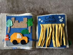 an open book with felt construction vehicles on it