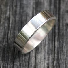 "This simple and chic sterling silver band measures 5x1.5mm and is made to order in any size desired. Available in Polished, Hammered, Brushed, Antiqued, or Hammered/Antiqued finish. If you don't see your size listed in the options, please specify your size in the \"note to seller\" portion of check out. **FREE SHIPPING WITHIN THE US** All of the items you see in my shop are made by me in my home studio and arrive in a gift box easy for gift giving!" Spinner Rings Womens, Sterling Silver Stone Rings, Plain Silver Ring, Simple Ring Band, Silver Ring Simple, Sterling Silver Rings Simple, Plain Silver Rings, Silver Rings Simple, Sterling Silver Stacking Rings