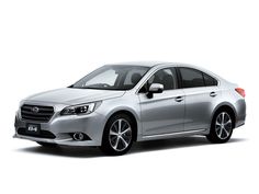 a silver subarunt parked in front of a white background