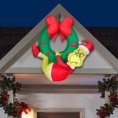 Add an eye-catching addition to your indoor or outdoor Christmas decorations with a hanging Airblown® Inflatable Grinch! This unique Grinch inflatable hangs from your roofline or eaves for an unexpected and delightful display. Immagini Grinch, Grinch Wreath, Dr Seuss Grinch, Wreath Hanging, Grinch Christmas Decorations, Santa Suit, Inflatable Decorations, Christmas Inflatables, Christmas Tree Shop