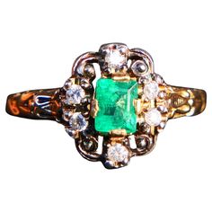 Beautiful Emerald and Diamonds Ring made in 1937. The crown is composite with the top parts in Silver, all other parts are solid 18K Yellow Gold. Natural emerald cut Emerald stone of vibrant Green 5.5 mm x 4 mm x 3.2 mm deep /0.5 ct accented with 6 old diamond cut Diamonds Ø 2 mm / 0.03 ct each. Diamonds with backs closed and foiled under. The Crown is 12 mm x 10 mm x 4 mm x deep. Size: Ø US 7.75 / 17.97 / sizable ring. Weight: 3.75 grams. Swedish ring, hallmarked 18K, unknown maker's mark, Stoc Nordic Ring, Old Rings, Photo Equipment, Ring Emerald, Old Jewelry, Emerald Stone, Maker's Mark, Vibrant Green, Natural Emerald