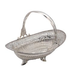 an ornate silver basket with handles on a white background, it is isolated from the side