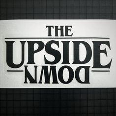 the upside down logo is shown in black and white, on a piece of paper