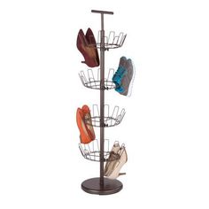 three pairs of shoes are hanging from a metal rack on a white background and there is no image here to provide a caption for