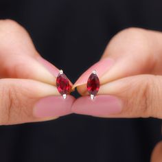 Product Details Simple yet elegant, these Solitaire Stud Earrings redefine sophistication. Crafted with precision, each earring features a Marquise Shape Lab Created Ruby gemstone set in 2 Prong Setting, exuding timeless charm. Secured with Screw Back Closure, these Ruby Stud Earrings (Synthetic) are a must-have addition to your jewelry collection. Experience the perfect blend of luxury and simplicity with these captivating Stud Earrings. Product Information SKU SHP-EARRINGS062196413 Length 8.8 Diamond Cut Marquise Earrings As A Gift, Diamond Cut Marquise Earrings For Gift, Marquise Setting, Ruby Stud Earrings, Ruby Earrings Studs, Solitaire Studs, Ruby Gemstone, Prong Setting, Screw