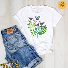 "All T-Shirt apparel are printed using direct-to-garment (also known as DTG). In addition, our inks are water-based and eco-friendly. This makes them feel much softer than traditional screen printed shirts, but just as durable. Vintage Butterfly Shirt, Butterfly Design Art, Butterfly Tee Shirt, Type Of Butterfly Shirt, Butterfly T Shirt, Types Of Butterflies **All sales are final and we don't accept returns. this is a customized and personalized product, and can not be resold. If we made a mista Relaxed Fit Butterfly Print Graphic Tee, White Butterfly T-shirt For Spring, Summer Cotton Shirt With Butterfly Print, White Cotton T-shirt With Butterfly Print, Summer Cotton T-shirt With Butterfly Sleeves, Casual Cotton Shirt With Butterfly Print, T Shirt Types, Types Of Butterflies, Shirt Types