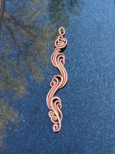 Inspired by nature's magic, trees, rocks, ocean waves, rippling waters and rivers. Each pendant is a custom one of kind piece, I personally make to order. See other matching wave rings and bracelets here: https://wizardswireworks.etsy.com Made with 100% pure copper wire. Pendant is 3" inches long and 1" inch wide. Contact me if you have questions, regarding shipping, materials, design or any other. Thanks so much Billy.    Copper offers many practical healing benefits to its wearer. Copper acts Copper Wire And Wood Art, Copper Wire Art Long, Electrical Copper Wire Art, Copper Wire Art Ideas, Emf Blocker, Magical Woods, Copper Wire Crafts, Wire Necklaces, Wire Ideas