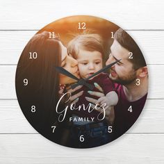 a clock with the words gone's family printed on it and two people kissing