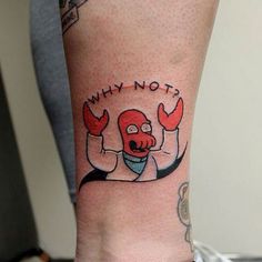 a person with a tattoo on their arm that says why nots and an image of a cartoon character