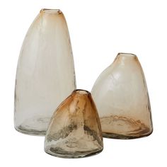 two glass vases sitting next to each other