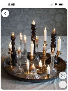 there are many candles on the tray and one candle is in the middle of it