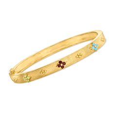 Ross-Simons - .30ct t. w. Multi-Gemstone Floral Bangle Bracelet Over Sterling. 7". An RS exclusive. Crafted in 18kt yellow gold over sterling silver, this bangle bracelet shines with .30 ct. tot. gem wt. garnet, peridot and sky blue topaz rounds in fanciful flower stations. Textured and polished finishes. Hinged with figure 8 safety. Box clasp, multi-gemstone floral bangle bracelet. Garnet birthstones are the perfect gift for January birthdays. Yellow Gold Bangle Bracelet With Gemstone Accents, Jeweled Yellow Gold Bangle Bracelet, Fine Jewelry Multi-stone Bangle Bracelet, Wedding Bangle Bracelet With Gemstone Accents, Anniversary Gemstone Accents Bangle Bracelet, Diamond Anklet, Italian Gold Jewelry, Safety Box, Garnet Birthstone