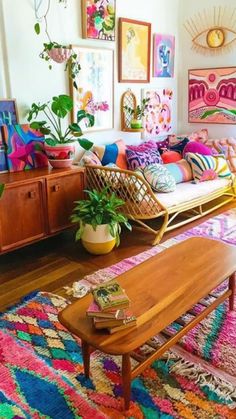 a living room filled with lots of colorful furniture and art on the wall above it