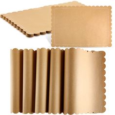 several pieces of brown paper with scalloped edges on a white background, including one piece of cardboard