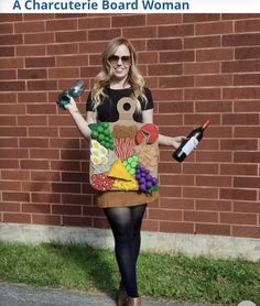 a woman in a costume holding a bottle and wine