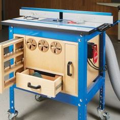 a blue workbench with drawers and tools in it