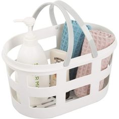 a white plastic basket with towels and soaps in it