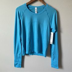 Nwt Lululemon Swiftly Tech Long Sleeve Shirt 2.0 *Race Length Kayak Blue Light/Kayak Blue Light Size 8 Blue Athleisure Activewear With Thumbholes, Blue Go-dry Long Sleeve Activewear, Blue Long Sleeve Go-dry Activewear, Sporty Blue Tops With Thumbholes, Blue Long Sleeve Running Activewear, Blue Long Sleeve Running Tops, Lululemon Shirts, Lululemon Swiftly Tech Long Sleeve, Swiftly Tech Long Sleeve