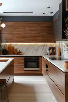 a modern kitchen with wood cabinets and marble counter tops, along with an island in the middle