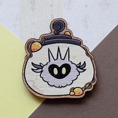 a patch with an image of a clock on it's face and the word evil inside