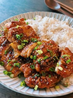 a white plate topped with chicken and rice