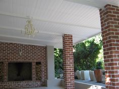 a brick fireplace in the middle of a patio