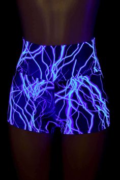 "This item is made to order, please read all the way through the listing before purchasing! Neon Blue Lightning print spandex is four way stretch for a great fit! The shorts have a high, anti muffin top waistband. UV glow and super duper neon under UV blacklight! LENGTH: 2.5\" inseam RISE: 11\" Womens Sizing (See below for instructions on where measurements should be taken) XXS: Bust 29\"-30\" / Waist 22\"-23\" / Hips 30\"-32\" Extra Small: Bust 31\"-32\" / Waist 24\"-25\" / Hips 33\"-35\" Small Blue 4-way Stretch Shorts, Stretch Rave Shorts, Fitted Rave Shorts, Blue Stretch Rave Bottoms, Fitted Rave Bottoms With Built-in Shorts, Blue 4-way Stretch Biker Shorts For Sports, Fitted Blue Rave Bottoms, Fitted Blue Bottoms For Rave, Blue Cheerleading Shorts