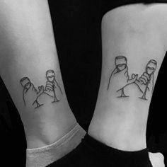 two people with matching tattoos on their arms