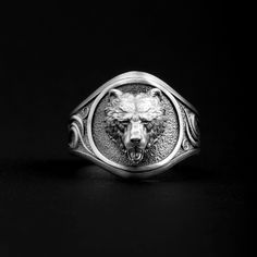 Our Bear Head Ring is a timeless piece of art that's perfect for any occasion. This one-of-a-kind handmade sterling silver ring features a beautifully detailed and delicate bear head design.  The 925 sterling silver used to craft this piece ensures the highest quality and durability. This special material also gives the ring a unique shine in any light, adding an elegant touch to your look. The bear head design adds sophistication and style to any ensemble, making it an ideal accessory for special occasions or everyday wear alike.  Take your style to the next level with our Bear Head Ring. With its classic look and high quality materials, this piece will be a treasured keepsake not only today but for many years to come. ➤ Item Details * Material: 925K Sterling Silver * Weight: 14-16 grams Bear Rings For Men, Silver Wolf Design Ring As Gift, Teddy Bear Ring, Wolf Design Ring Jewelry For Gift, Wolf Design Ring Jewelry Gift, Owl Signet Ring, Rings Gothic, Bear Design Pendant Jewelry Gift, Bear Ring