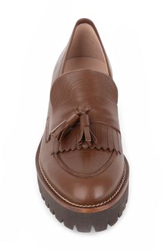 A lug sole lends an extra-toothy bite to a street-savvy leather loafer with a classic tassel detail on the fringed vamp. 1" heel Removable, cushioned insole with arch support Leather upper and lining/rubber sole Made in Spain Leather Loafers With Tassels And Almond Toe, Leather Oxfords With Tassels And Round Toe, Leather Almond Toe Loafers With Tassels, Fall Leather Moccasins With Tassels, Leather Tassel Loafers With Brogue Detailing For Fall, Leather Tassel Loafers With Fringe For Work, Fall Tassel Loafers With Leather Footbed For Work, Classic Leather Tassel Loafers With Fringe, Leather Tassel Loafers With Leather Footbed For Fall