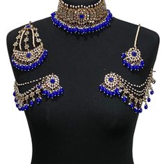 Handcrafted royal blue antique golden kundan Indian wedding / bridal jewellery set. Set includes- Earrings with multilayer pearl sahara  Choker necklace Jhumar Tikka  Our choker is adjustable with a dori at the back giving you a comfortable fit. It comes with elegant kundan earrings with pearl detail, tikka and jhumar with hooks.  The subtle glimmer of the kundan with elegant pearl detail makes this jewelry set a truly head turning piece, a must have for every jewellery box.  Our ethnic jeweller Ceremonial Blue Kundan Necklaces, Blue Kundan Necklaces For Ceremonial Occasions, Blue Chandbali Ceremonial Jewelry, Ceremonial Blue Kundan Necklace, Blue Chandbali Bridal Necklace For Wedding, Blue Kundan Necklace For Diwali Wedding, Blue Kundan Necklace For Wedding And Diwali, Blue Bollywood Style Ceremonial Jewelry, Heavy Blue Chandbalis For Wedding