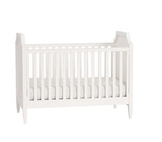 a white baby crib with no sheets on it's sides and the bottom half turned down