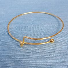 "This is gold toned single bar adjustable bangle bracelet. Material: Zinc Alloy Color: Gold Toned Measurement: 21 cm(8 2/8\") long You get 1 bracelet For bulk amounts request a custom order by clicking on the \"Request Custom Order\" button. Bulk amounts may sometimes take more days to ship out. Items ship within 1 business day" Gold Metal Bracelets With Sliding Knot, Gold Minimalist Bangle Charm Bracelet, Adjustable Yellow Gold Hoop Bracelets, Adjustable Hoop Yellow Gold Bracelet, Adjustable Yellow Gold Hoop Bracelet, Adjustable Minimalist Yellow Gold Charm Bracelet, Minimalist Adjustable Yellow Gold Charm Bracelet, Adjustable Gold Hoop Bracelets, Adjustable Bangle Charm Bracelet With Extender