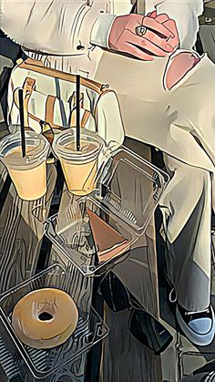 a man sitting on top of a table with donuts and drinks in front of him