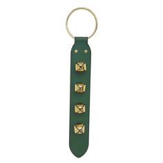 a green leather key chain with gold studs on the front and back ends, hanging from a metal ring