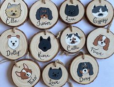 wooden ornaments with dogs on them are hanging from twine strings and decorated with wood slices