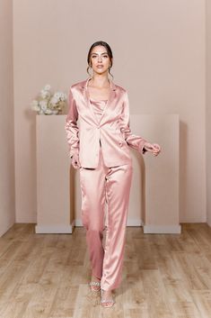 For the bridesmaid that doesn't want a dress, we have you covered! The new Ruby Satin Jacket & Pants set provides a glamorous alternative to a dress and will still have you feeling chic, confident, and comfortable all night long! The Ruby Jacket and Ruby Pants are sold separately. Lindsey size 4, pictured with the Flynn Satin Top in Desert Rose, sold separately. Laken size 24, pictured with the Heidi Chiffon Top in White Pearl, sold separately. FEATURES: Fitted Pants silhouette Side zipper Full- Pink Suits Women, Pants Silhouette, Jacket Silhouette, Bridesmaid Satin, Wedding Parties Colors, Fitted Pants, Satin Jacket, Fitted Jacket, Bridesmaid Dress Colors