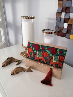 This Elephant Boho Clutch will bring elegance to your style. It will be chic with jeans or dresses and you may use this clutch bag both day and night.  This clutch bag is perfectly handmade with high quality natural jute fabric. Designed with a silk bohemian embroidery and a beaded trim. Clutch has a silk satin interfacing and a padding inside to stand upright. Closes with a magnet closing.  This bag is designed to fit all the things you need for comfortable everyday busy life. There will be eno Chic Rectangular Bags For Festive Occasions, Bohemian Beige Clutch Pouch, Bohemian Clutch With Handwork As A Gift, Beige Bohemian Clutch Pouch, Brown Embroidered Rectangular Clutch, Handmade Beige Bags For Festive Occasions, Beige Rectangular Clutch For Festivals, Bohemian Festive Clutch For Gifts, Bohemian Rectangular Pouch