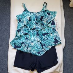 Pretty Blue Tankini Bathing Suit Set. Blue Tropical Print With Bra Pads Built In, Adjustable Straps. Navy Blue Matching Boy Short Bottoms. Sleeveless Blue Vacation Set, Blue Sleeveless Summer Set, Blue Summer Swimwear Sets, Blue Summer Swimming Sets, Fitted Blue Swim Sets, Blue Fitted Swim Set, Blue Swimming Sets, Fitted Blue Sets For Poolside, Blue Beachwear Sets For Poolside