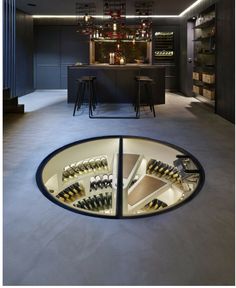 a wine cellar in the middle of a room