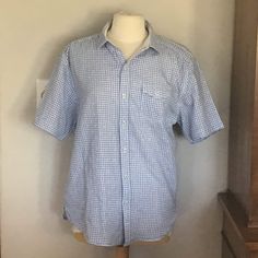 "This is a very nice size large all cotton Tommy Bahama blue and white gingham camp shirt. I like Tommy shirts in general because of the details. They go the extra mile for instance the shirt is lined with a lightweight white cotton to give it body, the stitching is done with green thread, the buttons are little white metal distressed ones, the gingham is a not just plain, it's fancier. All in all it adds up to a very cute summer camp shirt. It's in great condition with no rips or tears or fading, and it measures 24\" from pit to pit and 29 1/2\" from the back of the collar to the hem." Summer Camp Shirt, Tommy Shirt, Camp Shirts, Green Thread, Blue And White Gingham, Bahama Blue, Jeans Shirt, Extra Mile, Camp Shirt